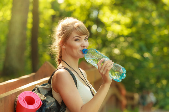 Tourist woman with backpack water bottle