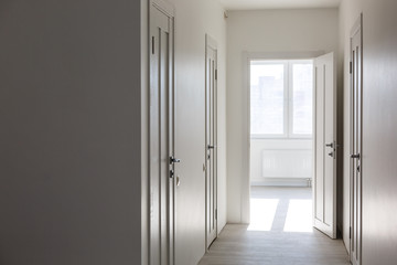 Empty white interior with door