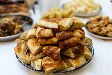 loaf of pitta bread on wooden table