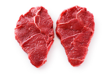 Fresh raw beef steaks isolated on white background.