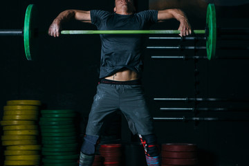 Man does power snatch exercise