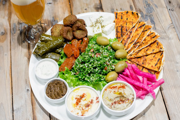 Restaurant dishes salads French fries cutlets olives
