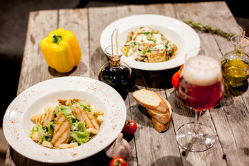 salads on the table with beer and wine