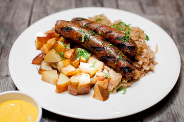 fried potatoes and sausages
