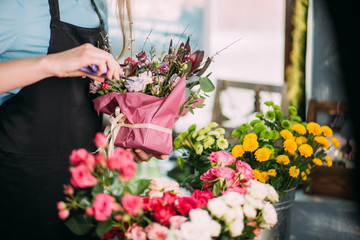 close up photo of florist's master class teaching how to prepare wonderful bouquets