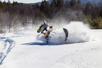 Athlete on a snowmobile.