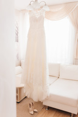 Wedding Dress Hanging in a Window