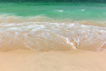 beach on the Persian Gulf with turquoise water and sand