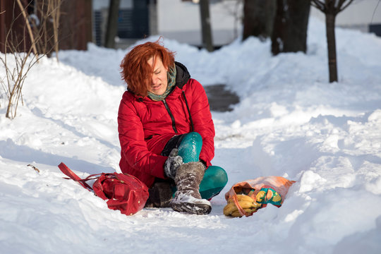 woman slipping on sidewalk,  winter accident
