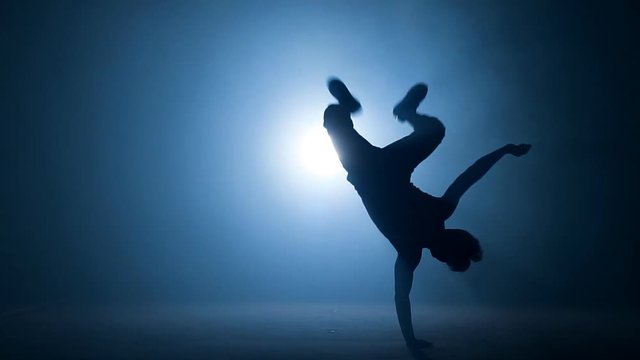 Young stuntman performing the trick in the air.