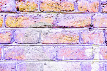 Textured brick wall of light pink color, homogeneous texture, stylish pattern for background