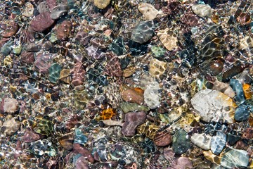 Colorful rolling stones pattern with water