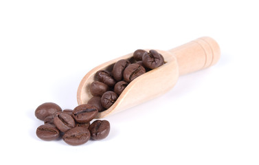 Group of coffee beans in a wooden scoop isolated on white background