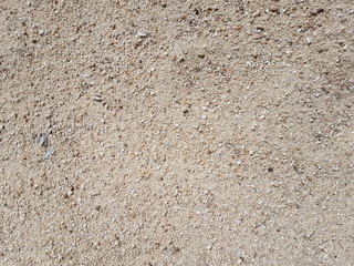 Textura de arena de parque de cerca, tonos beige, ocre,