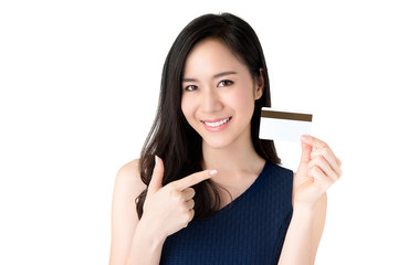 Young smiling beautiful Asian woman presenting credit card in hand