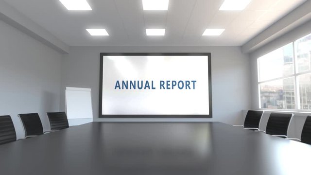 ANNUAL REPORT caption on the screen in a meeting room