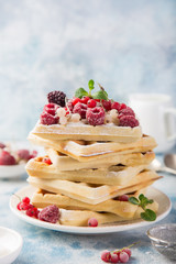 waffles with berries  and powdered suga