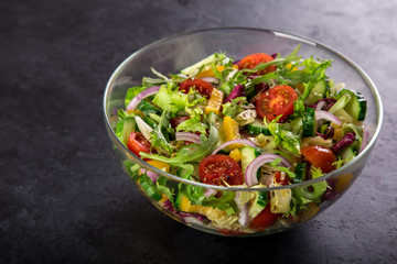 tomatoes, bell pepper, cucumber, lettuce and red onion salad
