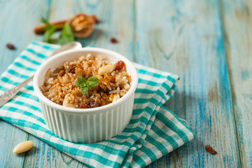Traditional, mexican baked sweet rice, with almonds, raisins and walnuts.