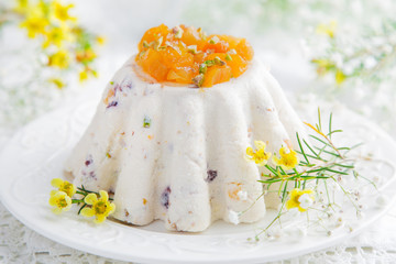 Fototapeta na wymiar Paskha. Traditional Russian Easter cottage cheese dessert with candied fruits and nuts