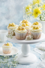 Easter cupcakes decorated with cream cheese frosting and candy eggs