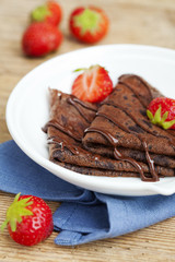 Chocolate pancakes with chocolate sauce