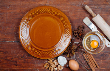 Empty plate and ingredients for baking cake or pie