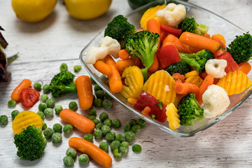 Raw vegetables cut in myskish several kinds of vegetables to prepare food laid on the table