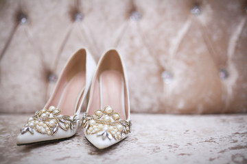 Fototapeta na wymiar Elegant and stylish bridal shoes. Selective focus.