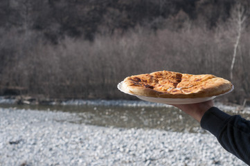 Caucasian khychin bread pie with meat close
