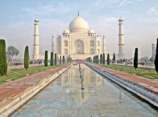 Fototapeta na wymiar Taj Mahal, Mausoleum and two minarets. Front view. Morning. Sunrise.