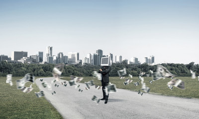 Businessman with monitor instead of head.