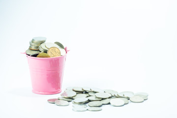 Full coins in pink bucket with coin money on white background