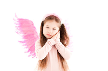 Cute baby girl 3-4 year old wearing pink wings over white background. Isolated.