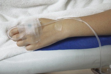 Crop short of A woman hospitalized in hospital for medical care.