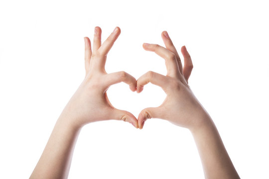 Female hands in the form of heart