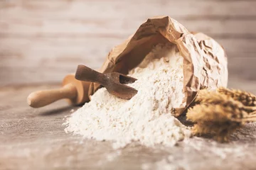 Selbstklebende Fototapeten Bag of flour © George Dolgikh