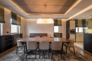 Open plan apartment interior, kitchen and dining area
