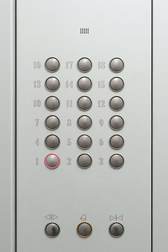 First floor by pressing the button in the elevator