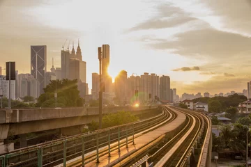 Foto op Canvas Sun rise brings a new day to the rapidly growing high tech city of Kuala Lumpur in Asia and is a good example of the regions booming economies and infrastructure © Harry Green