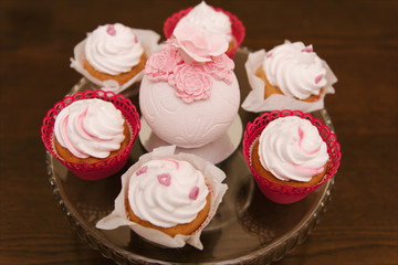 Red velvet cupcakes for Valentines Day in bright colorful setting, selection focus