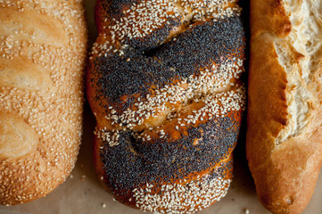 Different fresh bread, on old wooden table