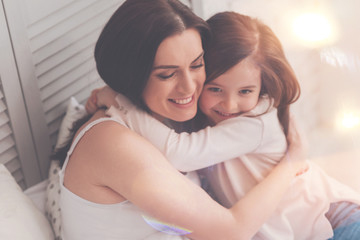 My precious gift. Sweet loving admirable mother and daughter sharing an emotional moment expressing their feelings while enjoying the morning at home