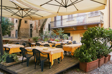 Bergamo, Italy - August 18, 2017: Cozy street cafe in the upper city.