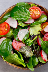 Fresh salad with baby spinach and tomato, radish und salad.