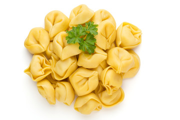 Raw homemade pasta,tortellini with herbs.