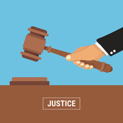 Hand holding judges gavel. vector illustration in flat design on blue background. justice concept.