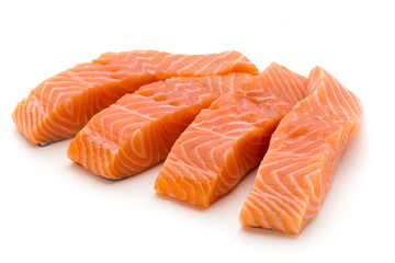 Fresh salmon fillet with basil on the white background.