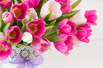 Pink tulip on the white background. Easter background