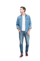 Fototapeta premium young smiling man in jeans, isolated on white